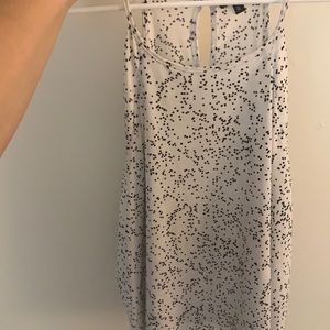 White with black dots, perfect condition.